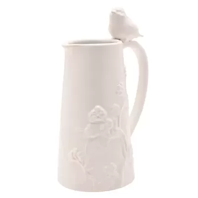 Jarro branco de cerâmica com relevo floral e pássaro na pega