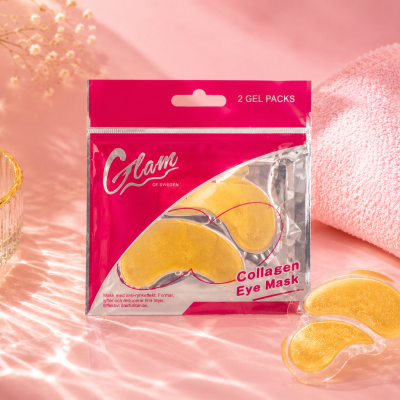 Máscara de gel dourada para olhos com embalagem rosa, pano cor-de-rosa, pérola e tigela de vidro