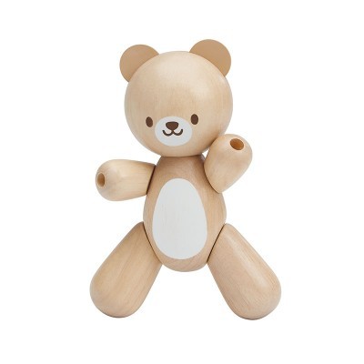 Ursinho de madeira claro com detalhes brancos e braços e pernas articulados