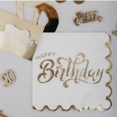 Guardanapo branco com texto dourado HAPPY Birthday e decoração dourada de aniversário