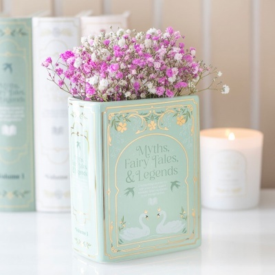 Vaso decorativo verde-água com flores rosa e brancas e ilustração de cisnes.