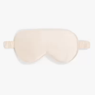 Máscara de dormir bege claro com elásticos laterais