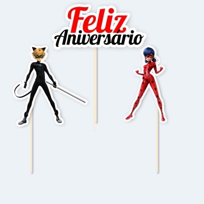 Palitos decorativos para bolo com personagens e texto 'Feliz Aniversario'.