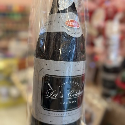 Garrafão confetti cannon Let´s Celebrate preto e cinza embalada em plástico transparente numa loja.