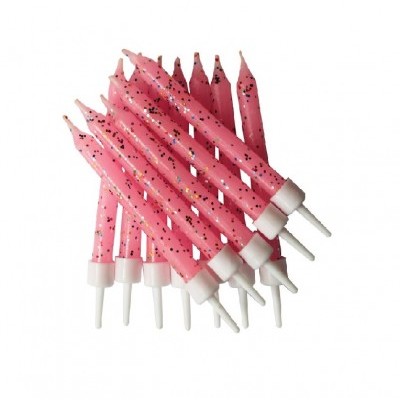 dez velas de aniversário cor-de-rosa com pontos pretos e brancos com suporte branco
