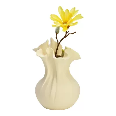 Vaso de cerâmica bege com flor amarela artificial