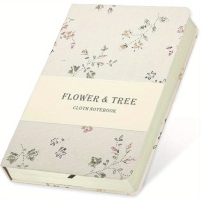 Caderno com capa em tecido floral e banda branca com texto