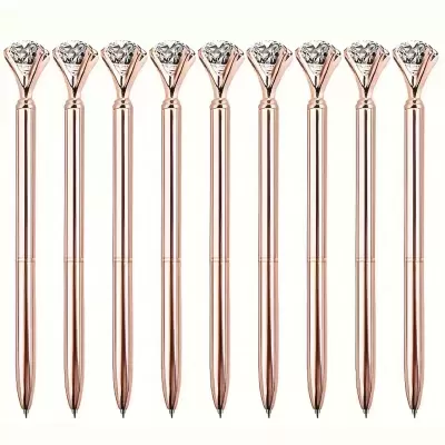 Dez canetas com corpo ouro rosado e cristal no topo alinhadas verticalmente