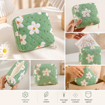 Bolsa verde acolchoada com flores brancas e amarelas e fecho zipper, vista em várias perspetivas.