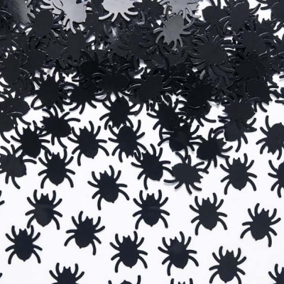Confetes pretos em forma de aranha sobre fundo branco