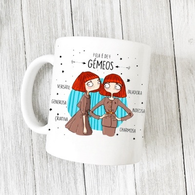Caneca branca com ilustração e texto em português sobre signo Gémeos