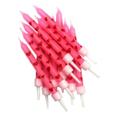 Velas cor de rosa com corações vermelhos para festa