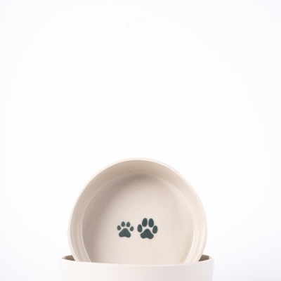 Tigelas para animais de estimação brancas com pegadas pretas no interior