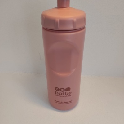 Garrafa reutilizável cor-de-rosa em plástico com texto eco bottle