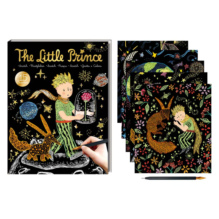 Livro de atividades The Little Prince com cenas para raspar, folhas coloridas e caneta em fundo branco.