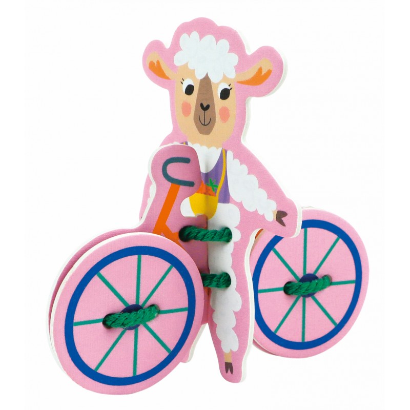Brinquedo de madeira em forma de ovelha cor-de-rosa a andar de bicicleta