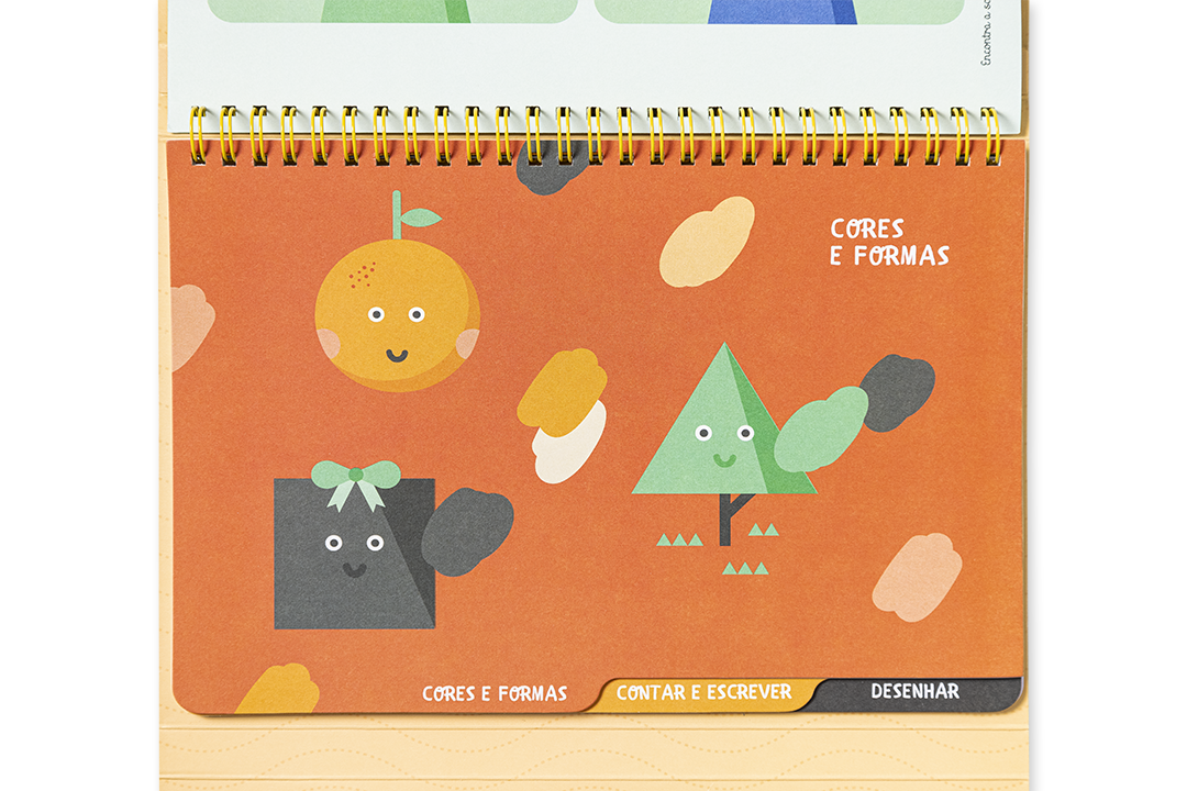 Página de livro infantil com formas geométricas coloridas e texto CORES E FORMAS