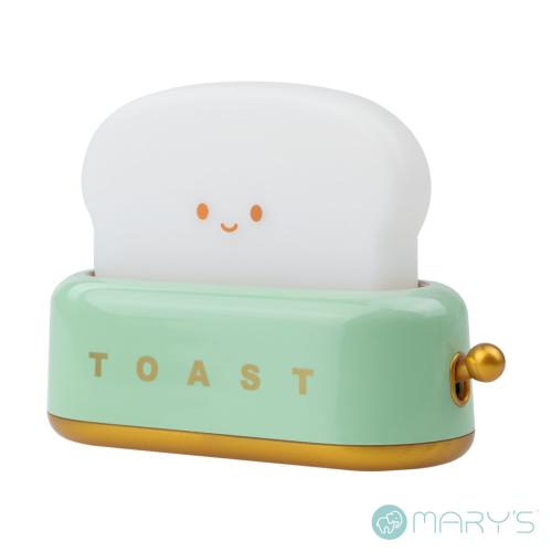 Figura decorativa de torradeira verde com fatia de pão sorridente