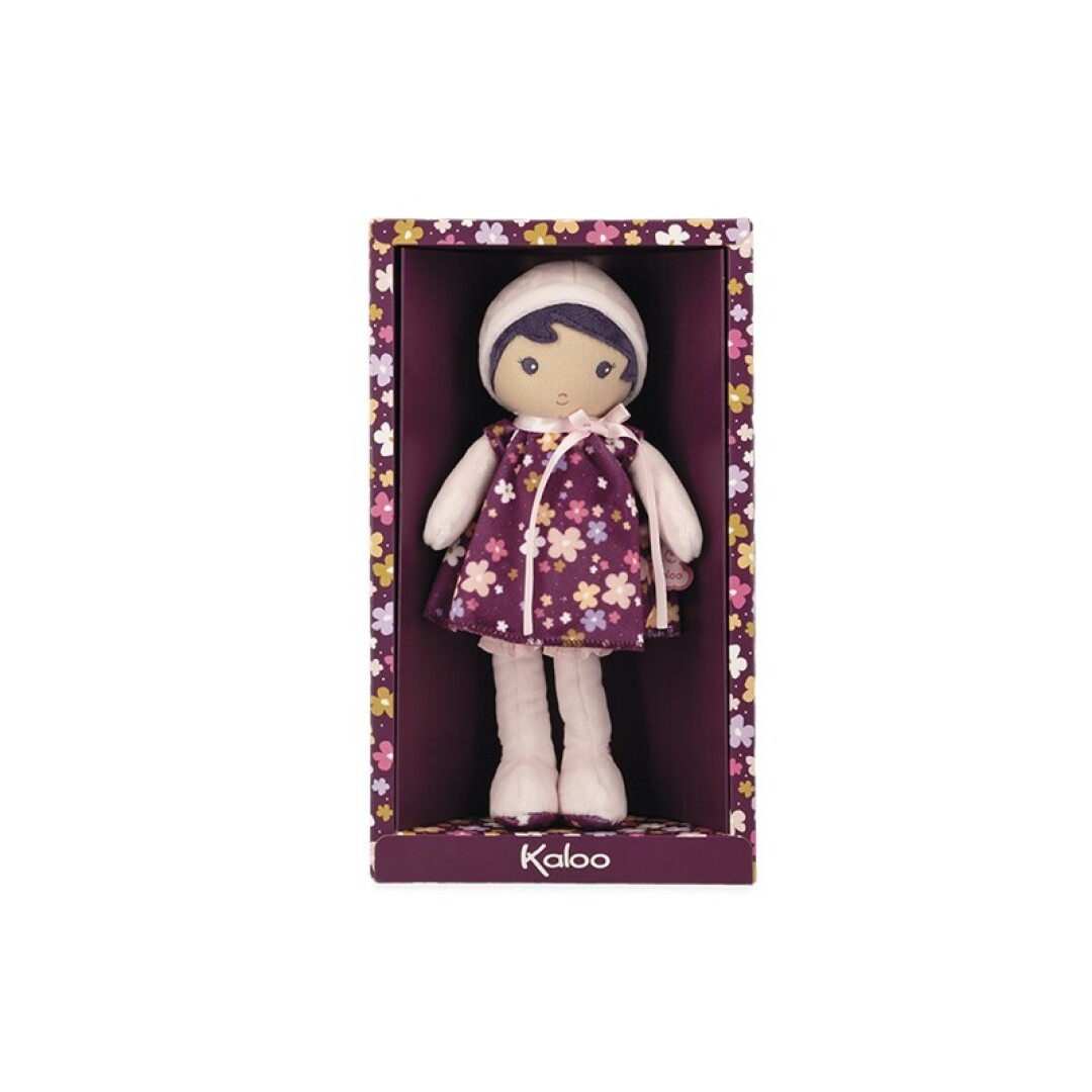 Boneca de peluche com vestido roxo floral em caixa com padrão floral