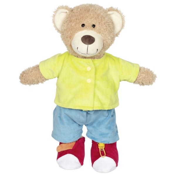 Urso de peluche vestido com roupa amarela, azul e sapatos vermelhos