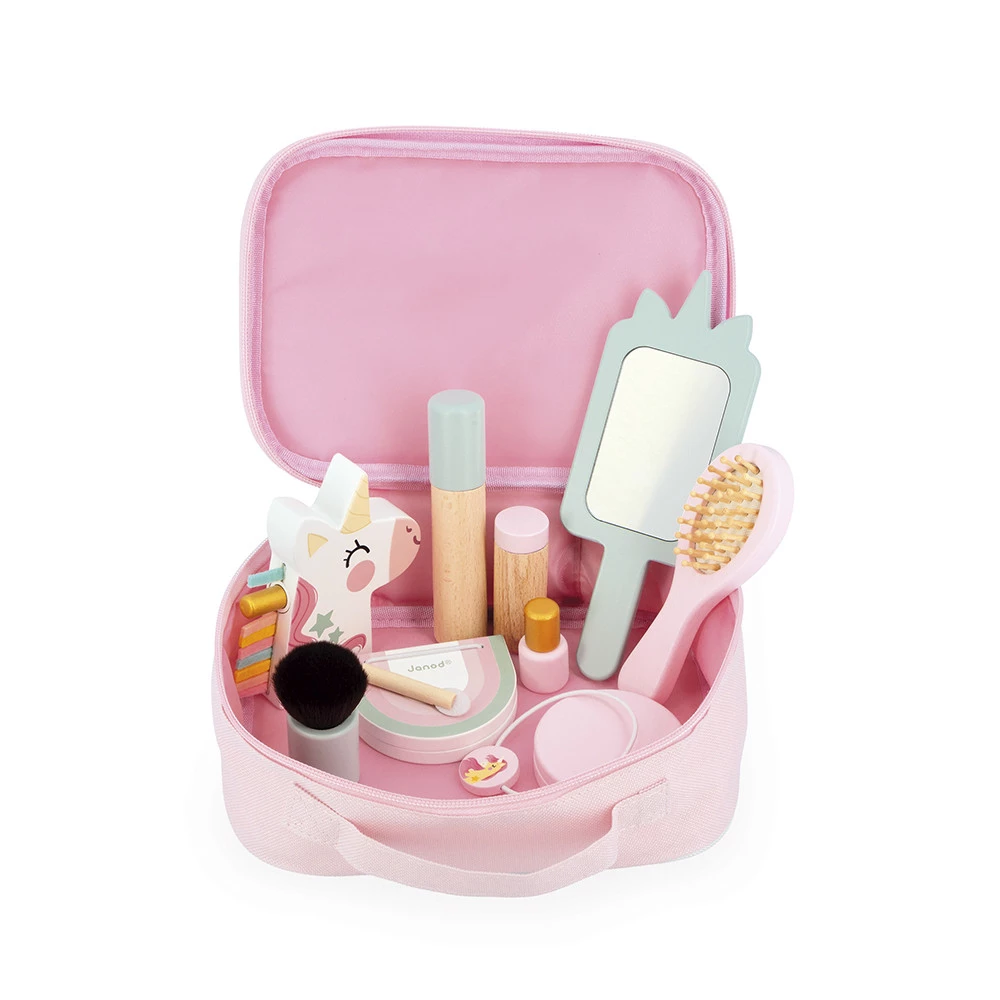 Estojo rosa aberto com acessórios de maquilhagem de brinquedo e figura de unicórnio