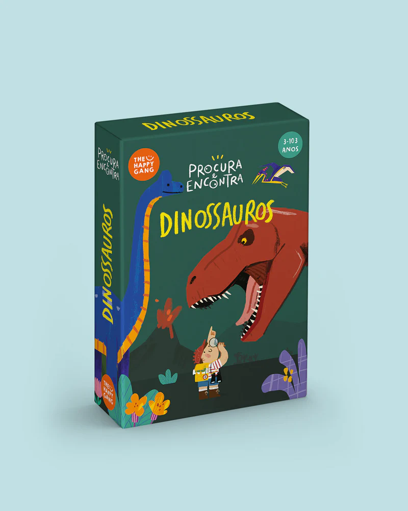 Caixa de jogo infantil com ilustrações de dinossauros e criança, texto PROCURA E ENCONTRA DINOSSAUROS
