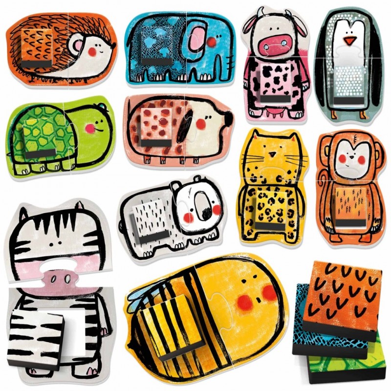 Ímanes decorativos coloridos em forma de vários animais cartoon sobre superfície branca.