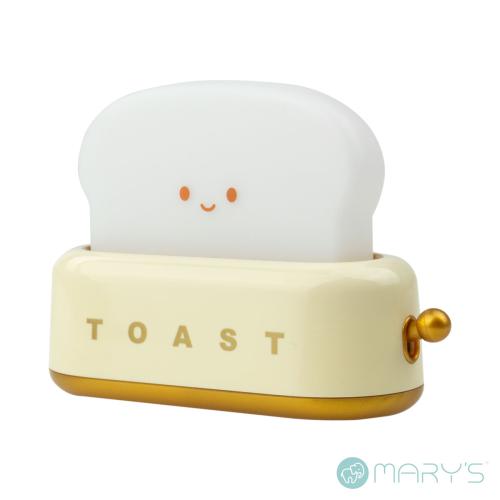 Luminária de mesa em formato de torradeira com fatia de pão sorridente