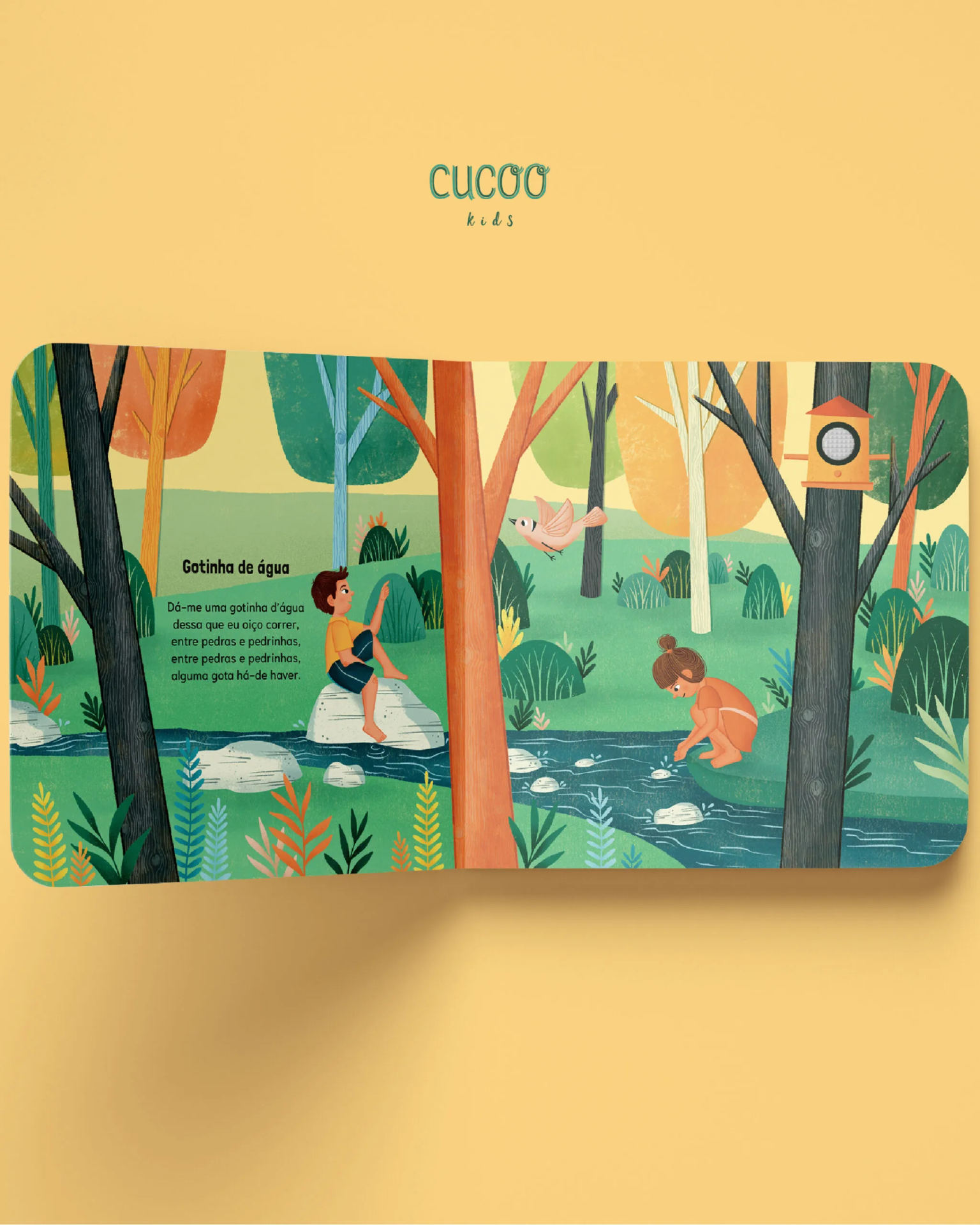 Livro infantil ilustrado com crianças e riacho numa floresta colorida