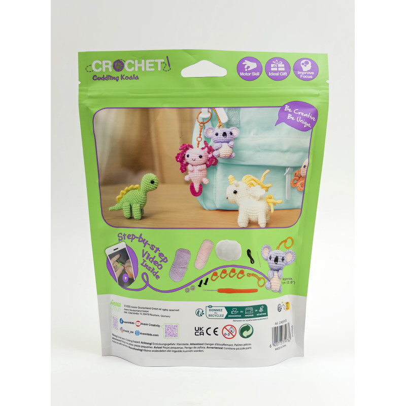 Embalagem verde de kit de croché com figuras de dinossauro, sereia, coala e unicórnio de croché.