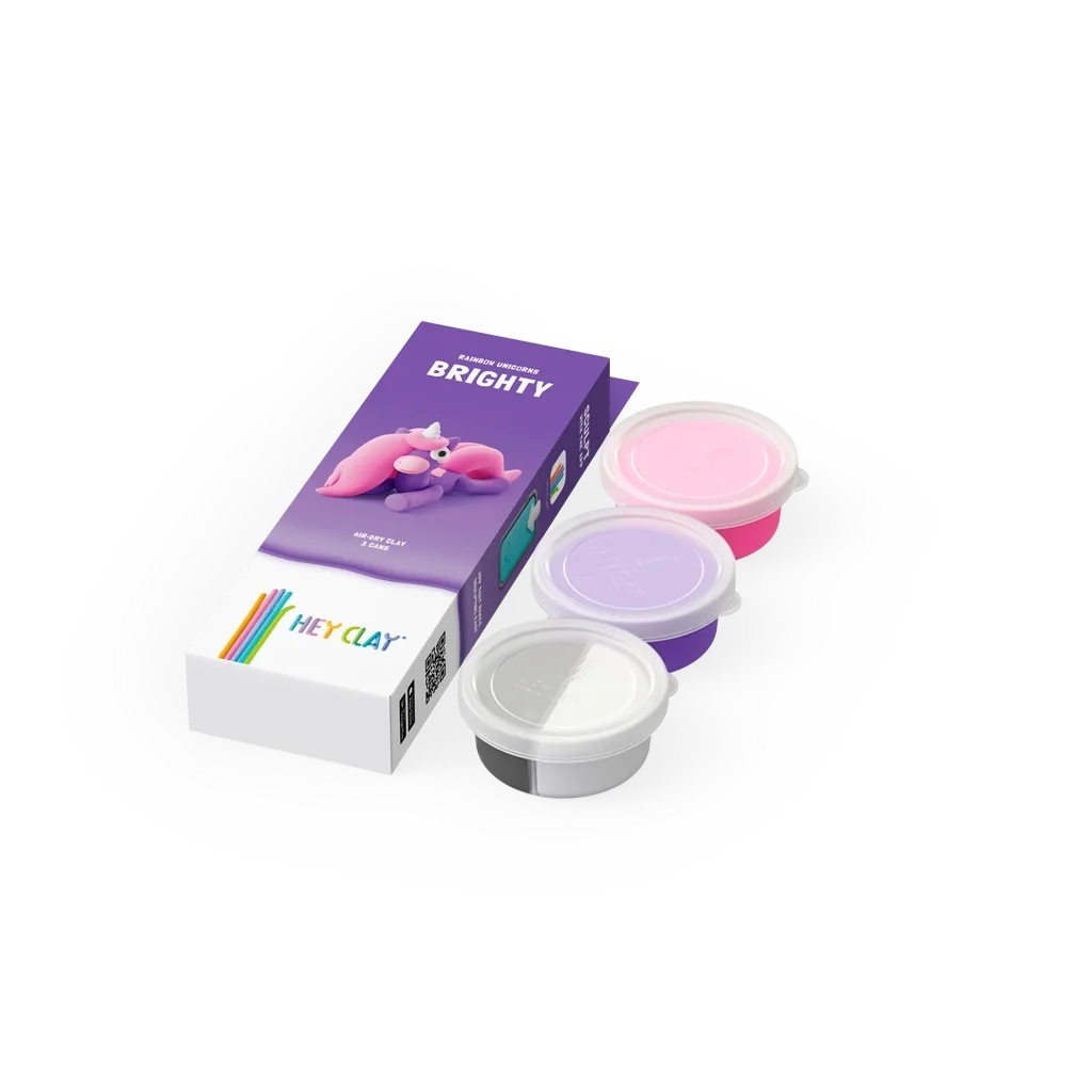 Conjunto de massinha de modelar HEY CLAY cores rosa, lilás e branco com caixa roxa e branca e unicórnio desenhado