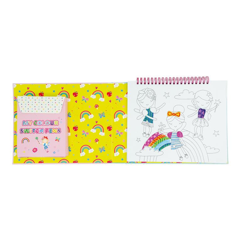 Livro de colorir aberto com fadas para colorir e caixa rosa com canetas coloridas