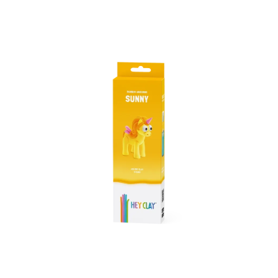 Embalagem amarela com unicórnio amarelo e crina laranja, texto RAINBOW UNICORN SUNNY e HEY CLAY.