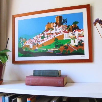 Quadro emoldurado com arte colorida de paisagem urbana e castelo