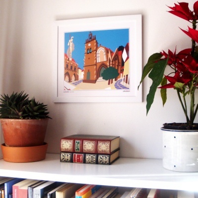 Estante branca com livros, vasos com plantas e ilustração colorida em moldura branca na parede