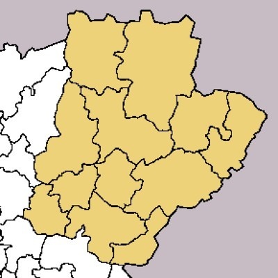 Mapa de regiões destacadas em amarelo com contornos a preto num fundo cinzento