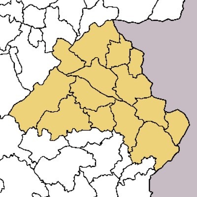 Mapa político com área amarela ao centro e branco e cinza ao redor