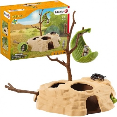 Brinquedo Schleich Wild Life com rocha, árvore e figuras de mamífero e inseto.