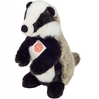 Pelúcia de texugo em tecido felpudo preto, branco e castanho