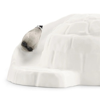 Miniatura de urso polar a descer uma colina branca