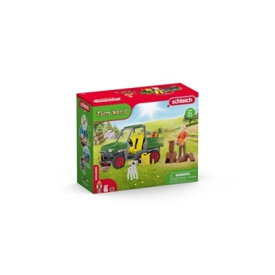 Caixa de brinquedo Farm World Schleich com trator e figuras numa paisagem campestre