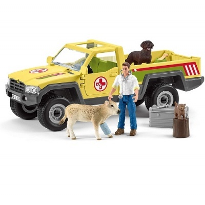 Brinquedo de jipe amarelo com figuras de animais e pessoa
