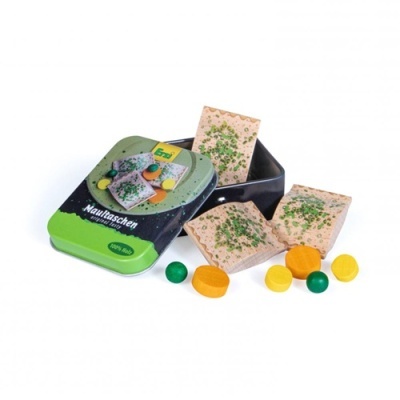 Caixa metálica com pães retangulares com ervas e pastilhas coloridas ao redor