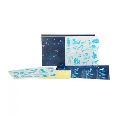 Conjunto de papelaria com temas de constelações em azul, amarelo e branco
