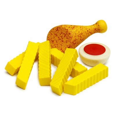 Brinquedo de perna de frango amarilla, peças amarelas texturizadas e objeto redondo branco com círculo vermelho