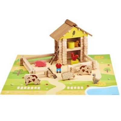 Brinquedo de madeira com celeiro, animais e boneco sobre base ilustrada