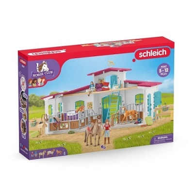 Caixa do brinquedo Schleich Horse Club com um estábulo e figuras de cavalos e humanos.