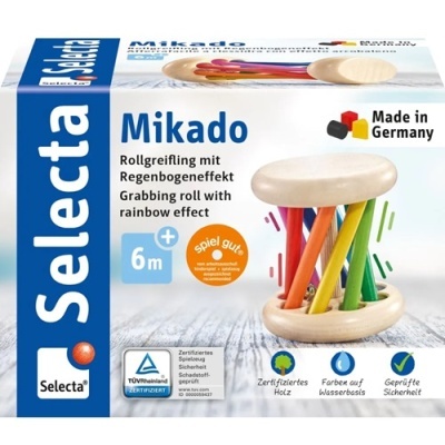 Brinquedo Selecta Mikado em embalagem com cores azul, branca e texto em alemão e inglês, rolo de madeira clara com varas coloridas.