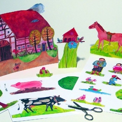 Figuras recortáveis em papel de elementos rurais com casa, animais, pessoas e árvore num fundo branco.