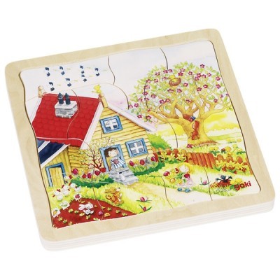 Puzzle de madeira com ilustração de casa, árvore e jardim coloridos.